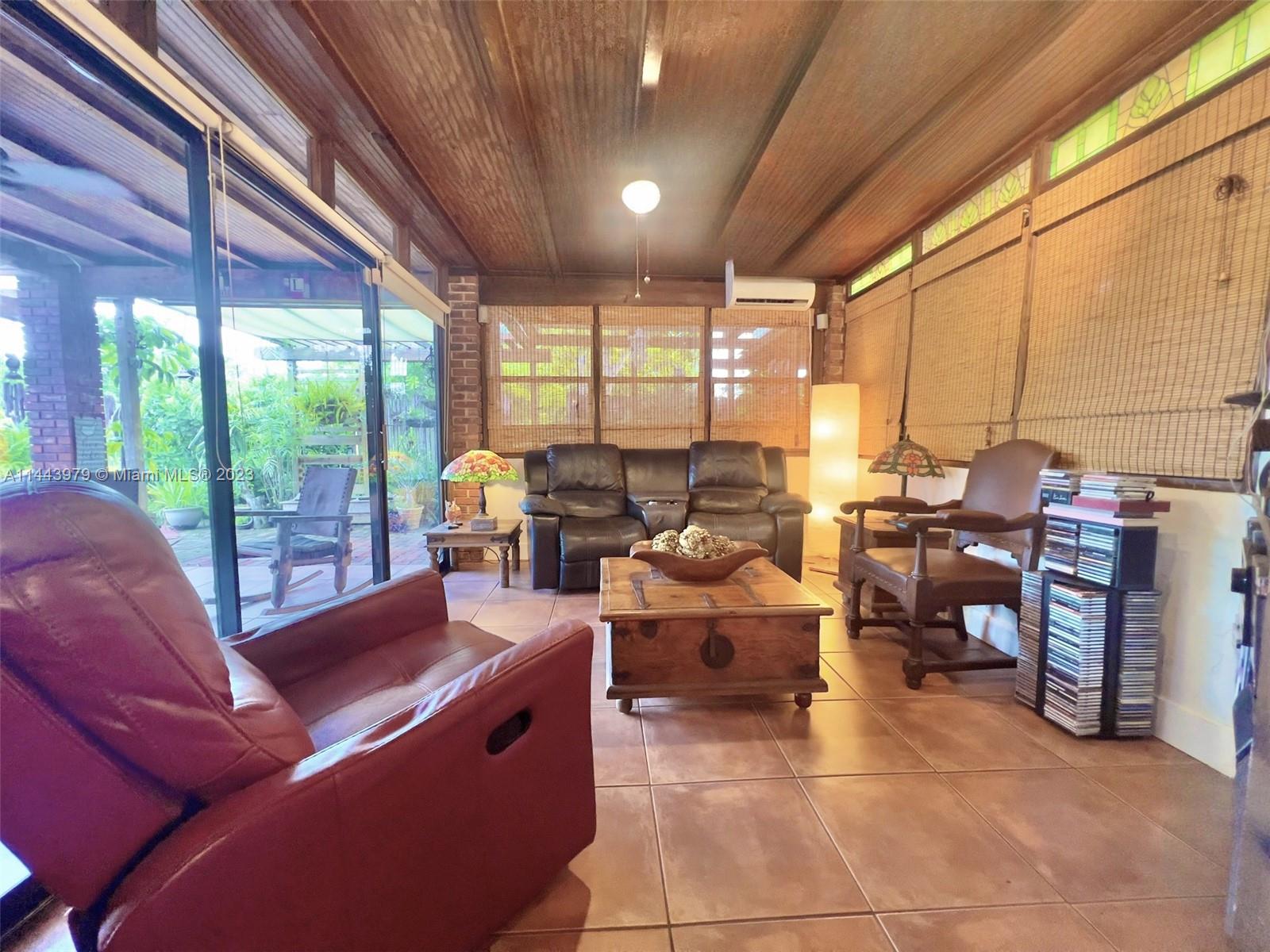 11370 Southwest 118th Street Miami, FL 33176 - Photo 13 of 26 a living room with furniture a large window