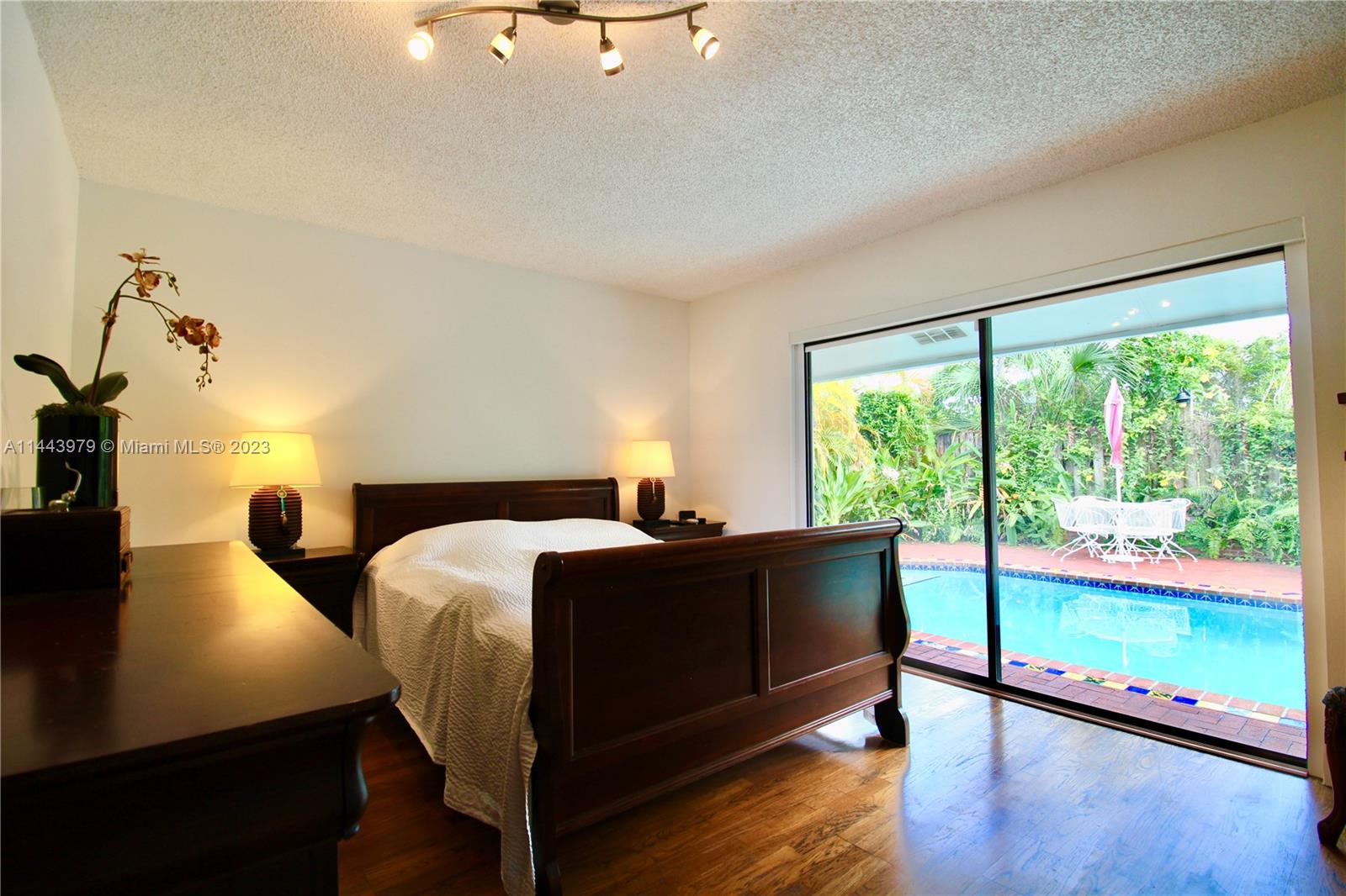 11370 Southwest 118th Street Miami, FL 33176 - Photo 15 of 26 a bed room with bed and a large window