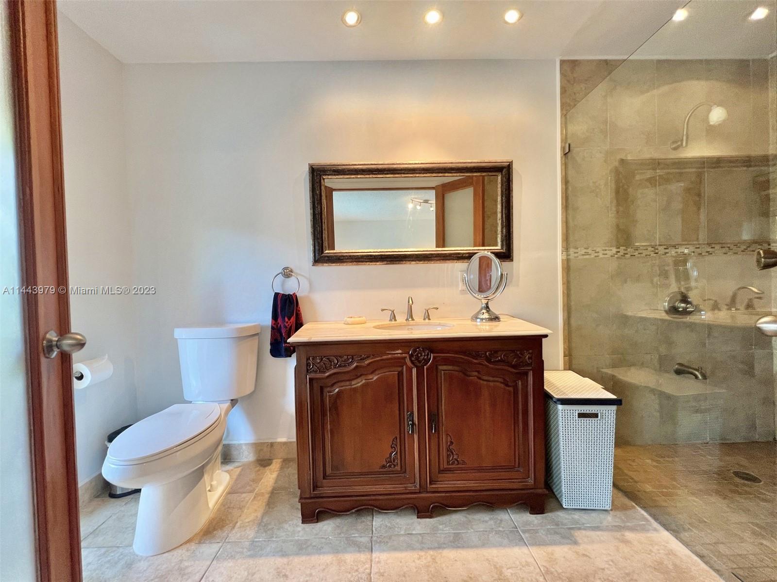 11370 Southwest 118th Street Miami, FL 33176 - Photo 18 of 26 a bathroom with a sink and a toilet