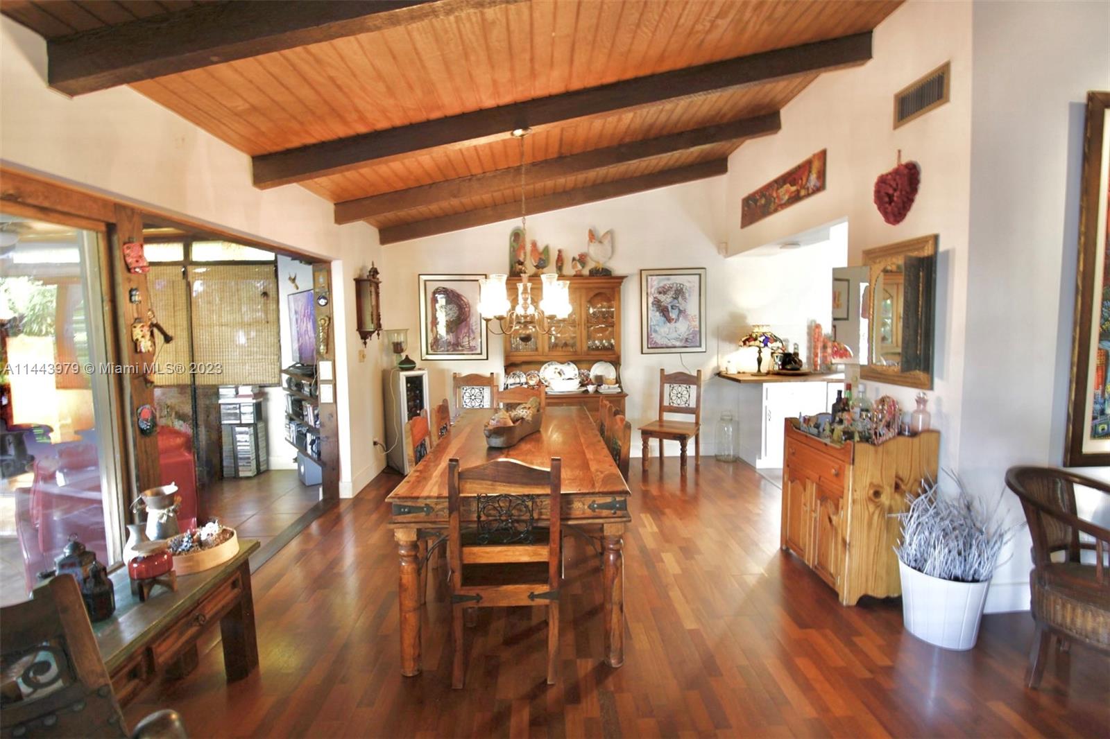11370 Southwest 118th Street Miami, FL 33176 - Photo 2 of 26 a dining room with wooden floor