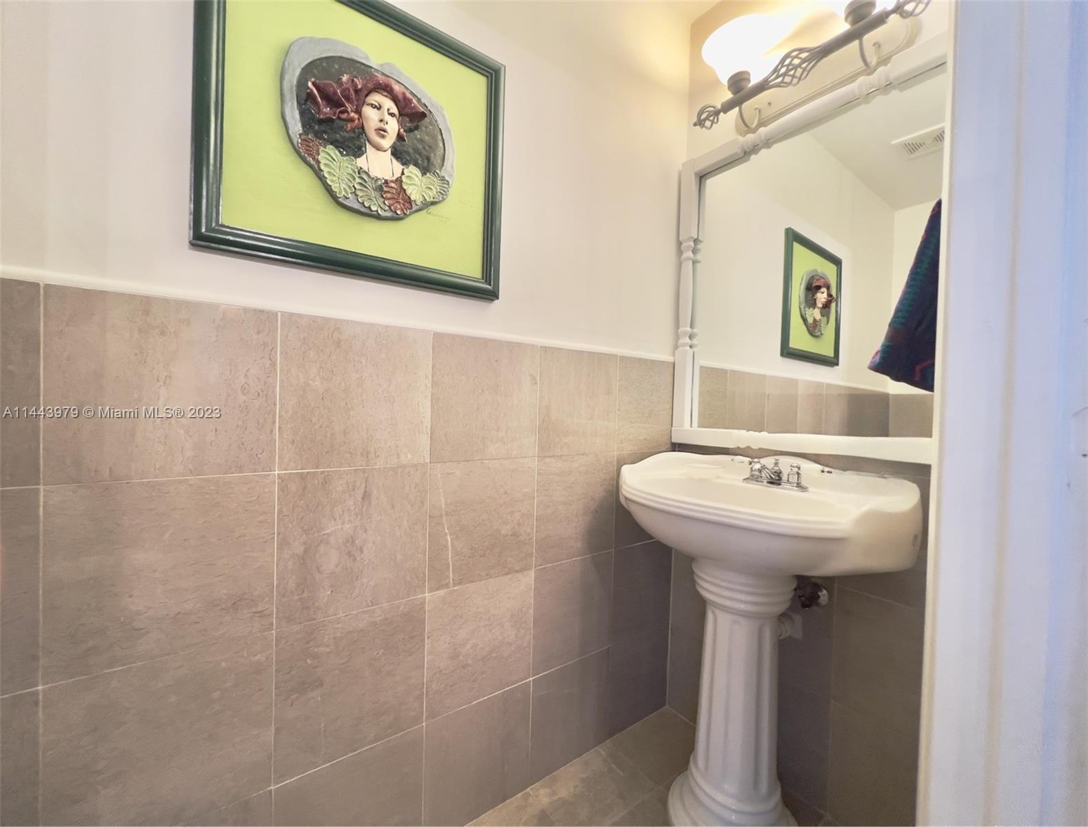 11370 Southwest 118th Street Miami, FL 33176 - Photo 25 of 26 a bathroom with a sink and mirror