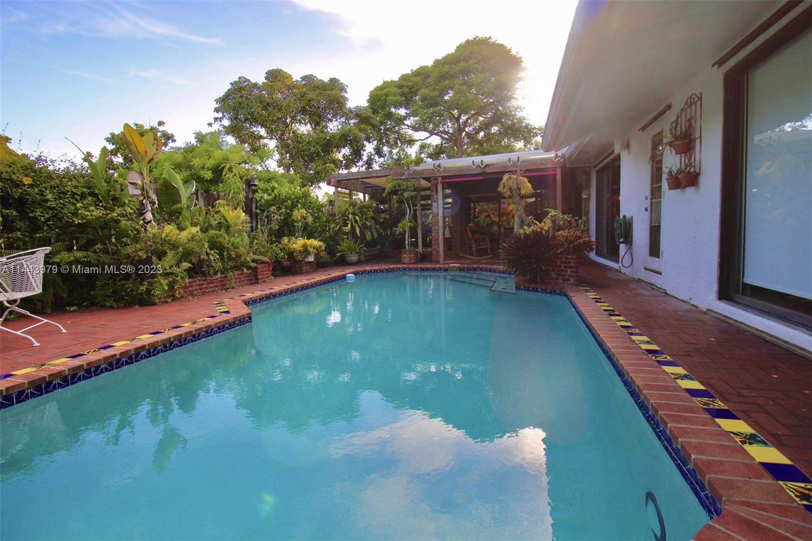 11370 Southwest 118th Street Miami, FL 33176 - Photo 26 of 26 a backyard of a house with lots of green space