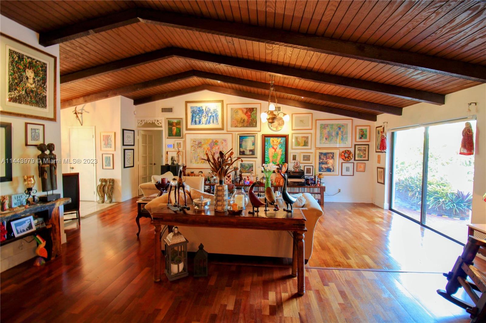 11370 Southwest 118th Street Miami, FL 33176 - Photo 10 of 26 a view of a room with lots of furniture and wooden floor