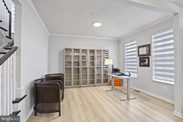 a work room with furniture and a window