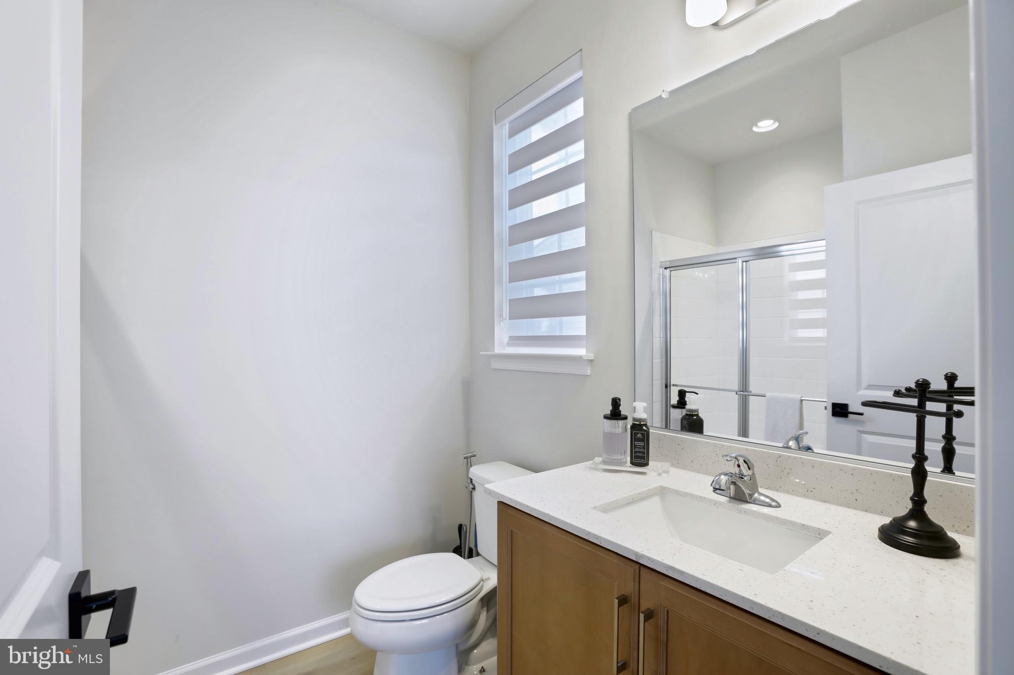 1011 Monocacy Crossing Parkway Brunswick, MD 21716 - Photo 14 of 43 a bathroom with a sink a toilet and a mirror