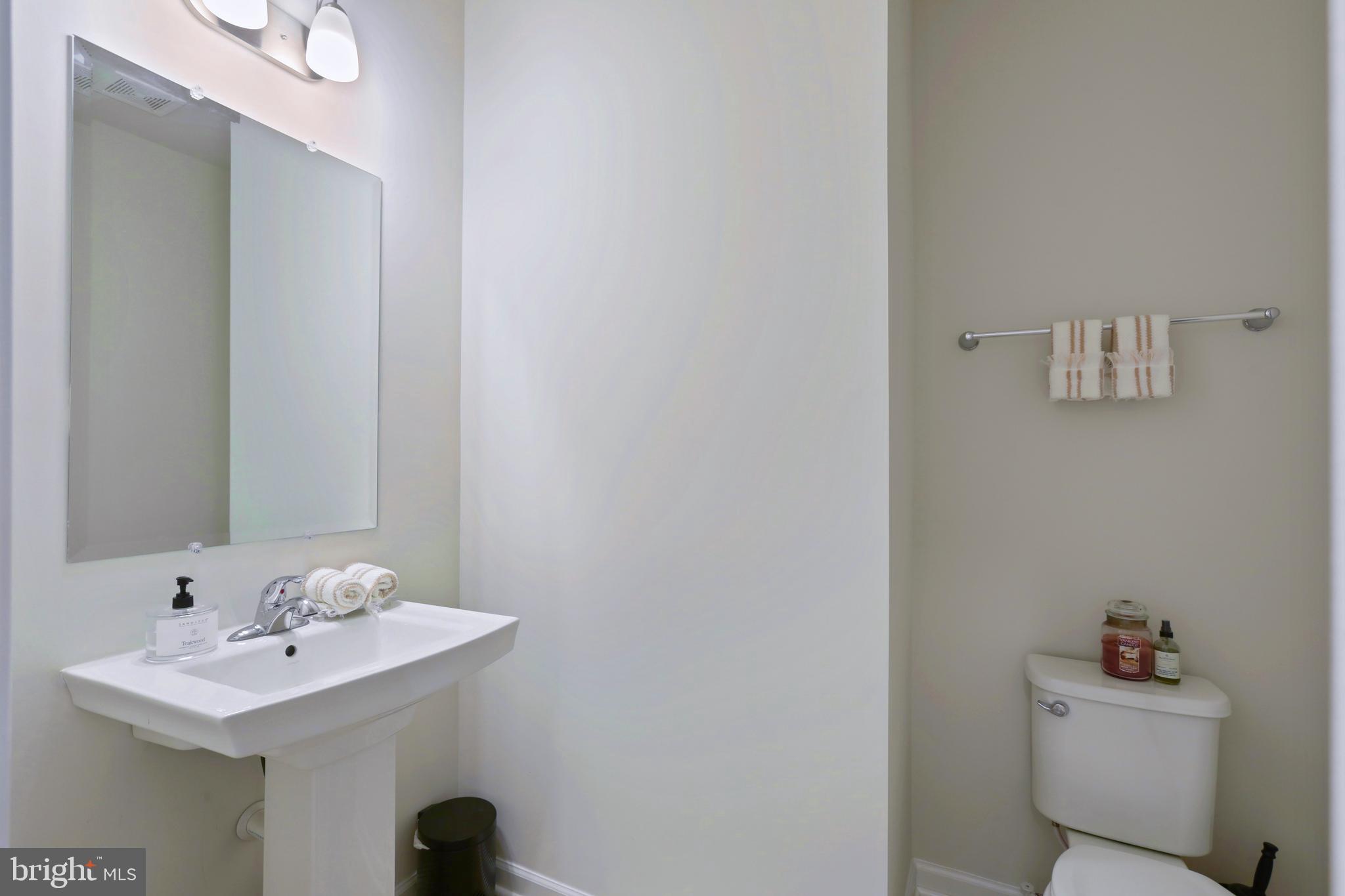 1011 Monocacy Crossing Parkway Brunswick, MD 21716 - Photo 15 of 43 a bathroom with a sink a toilet and a mirror