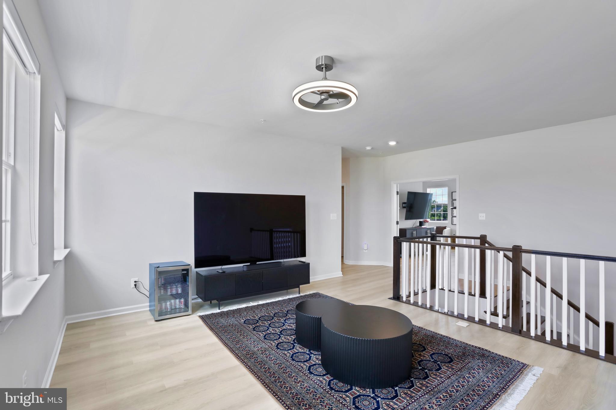 1011 Monocacy Crossing Parkway Brunswick, MD 21716 - Photo 17 of 43 a living room with furniture and a flat screen tv