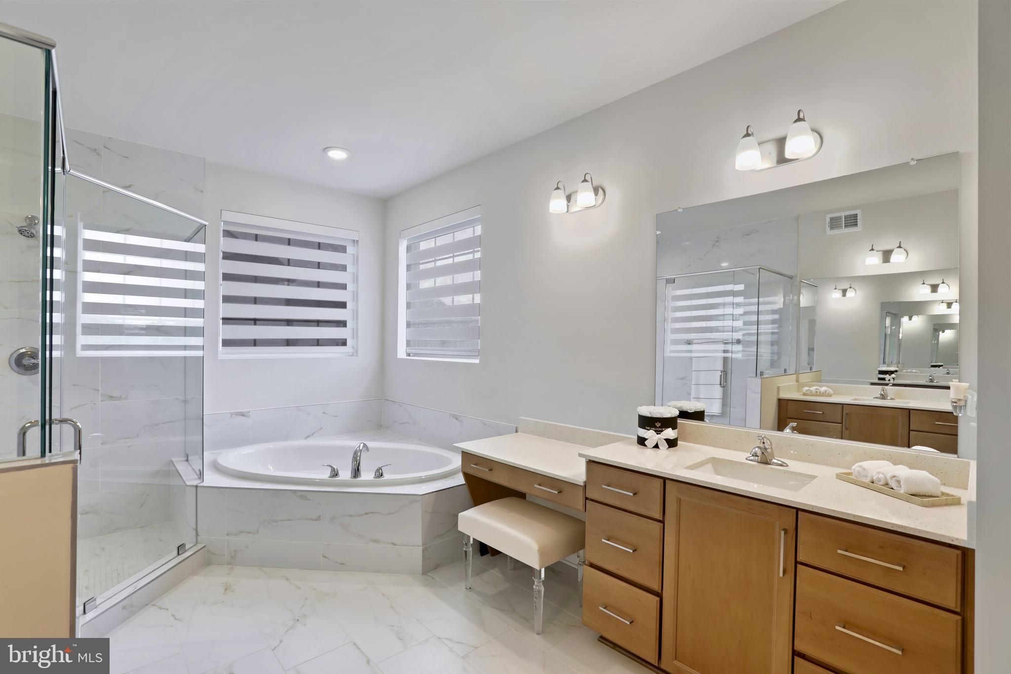 1011 Monocacy Crossing Parkway Brunswick, MD 21716 - Photo 22 of 43 a bathroom with a bathtub a sink and a large window