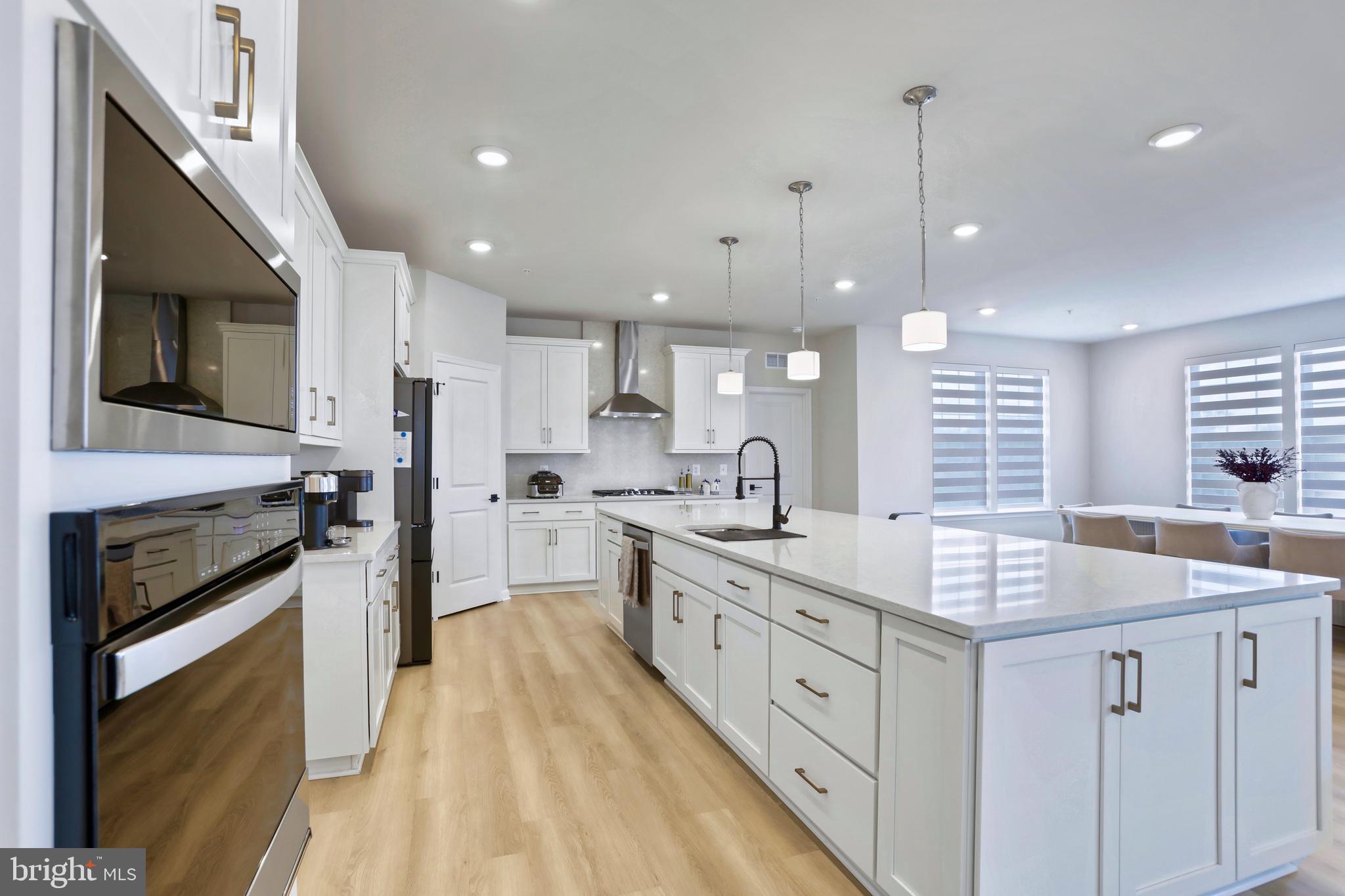 1011 Monocacy Crossing Parkway Brunswick, MD 21716 - Photo 4 of 43 a kitchen with white cabinets sink and stainless steel appliances