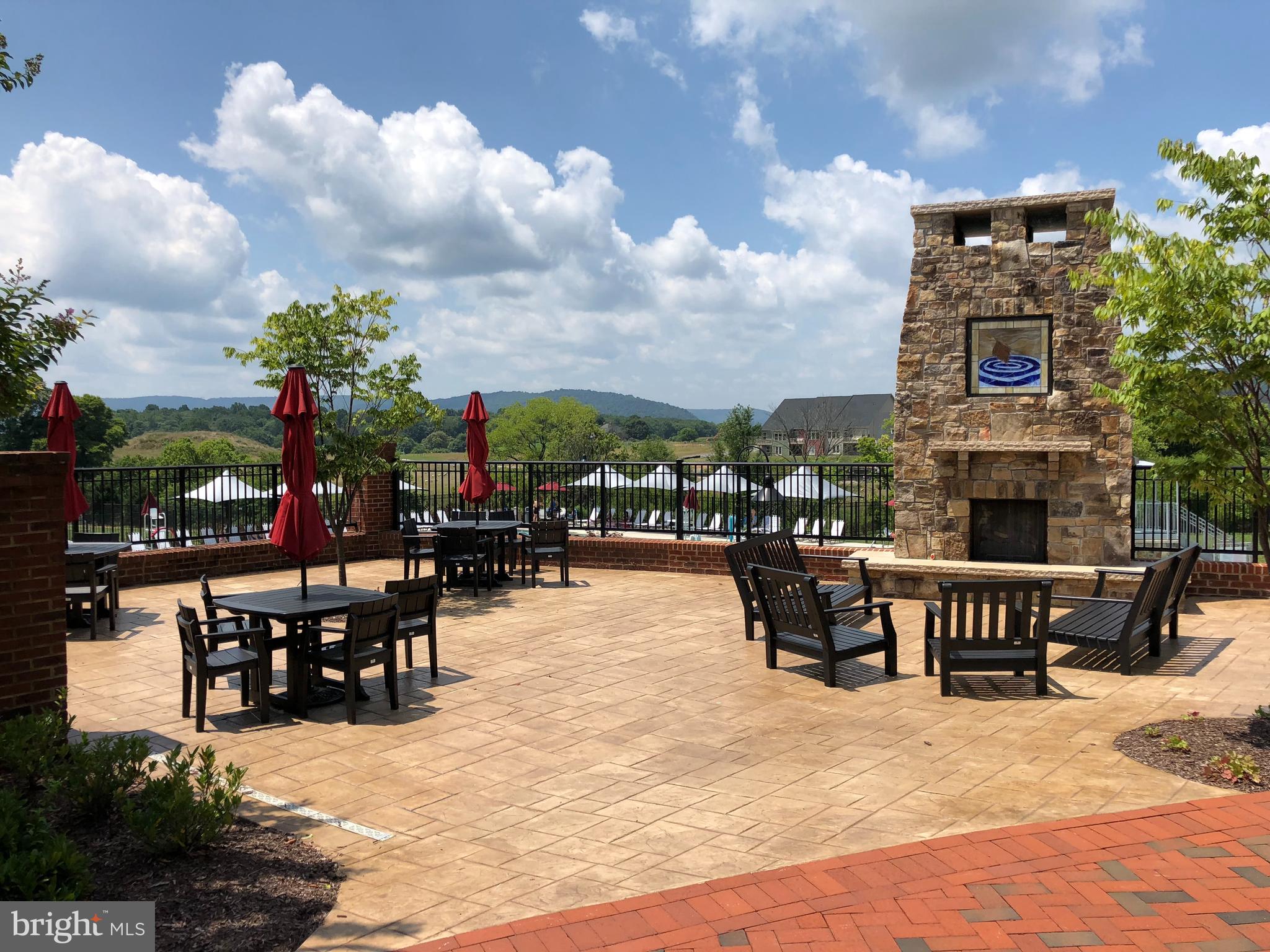 1011 Monocacy Crossing Parkway Brunswick, MD 21716 - Photo 41 of 43 a view of a patio with dining table and chairs with a fire pit
