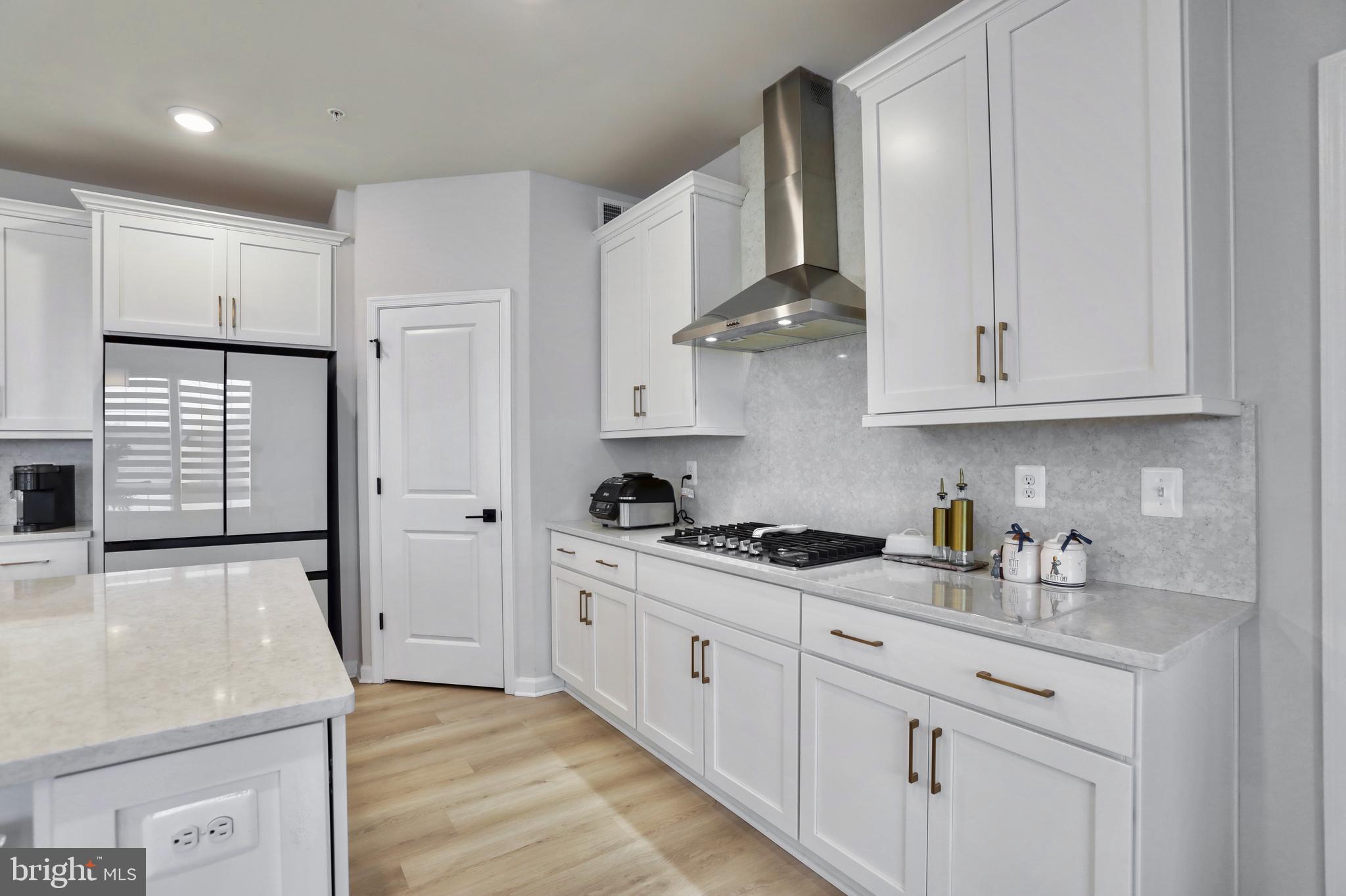 1011 Monocacy Crossing Parkway Brunswick, MD 21716 - Photo 5 of 43 a kitchen with stainless steel appliances granite countertop a sink stove and cabinets