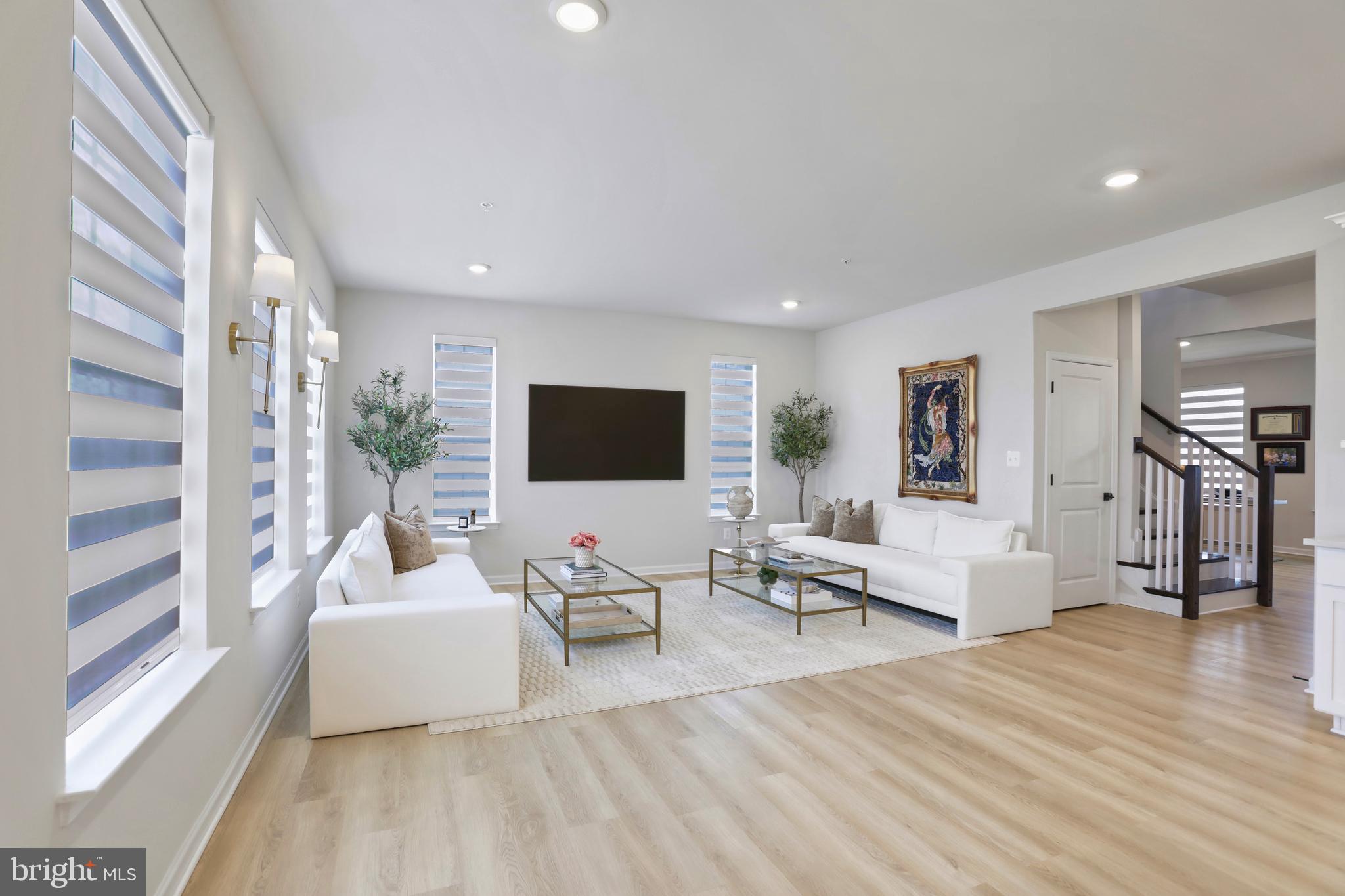 1011 Monocacy Crossing Parkway Brunswick, MD 21716 - Photo 9 of 43 a living room with furniture and a flat screen tv