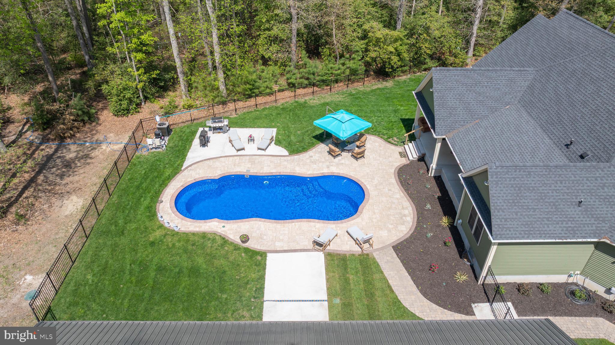 26750 Deep Branch Road Milton, DE 19968 - Photo 22 of 96 an aerial view of a house with yard swimming pool and outdoor seating