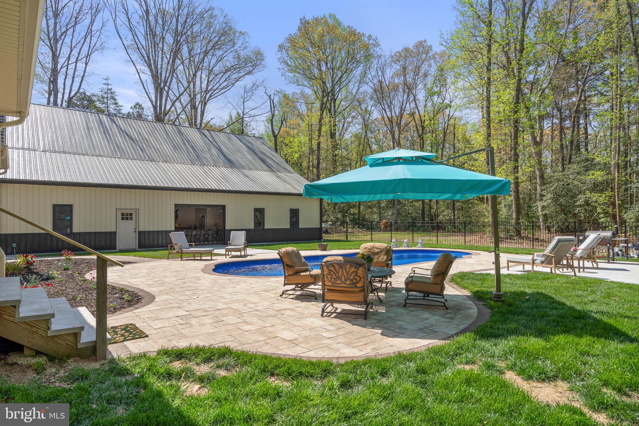 26750 Deep Branch Road Milton, DE 19968 - Photo 28 of 96 a view of a house with backyard and sitting area