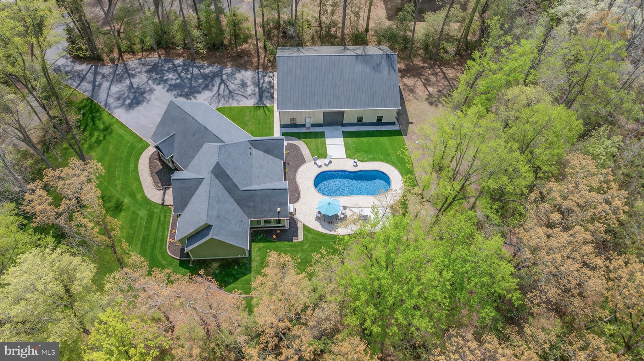 26750 Deep Branch Road Milton, DE 19968 - Photo 39 of 96 an aerial view of a house with swimming pool and big yard