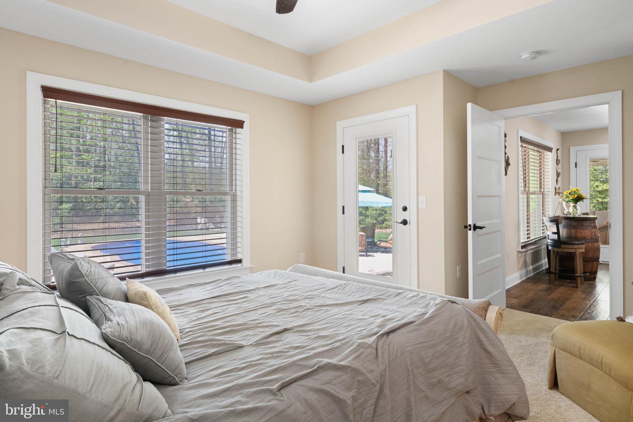 26750 Deep Branch Road Milton, DE 19968 - Photo 66 of 96 a bedroom with a large bed and a large window