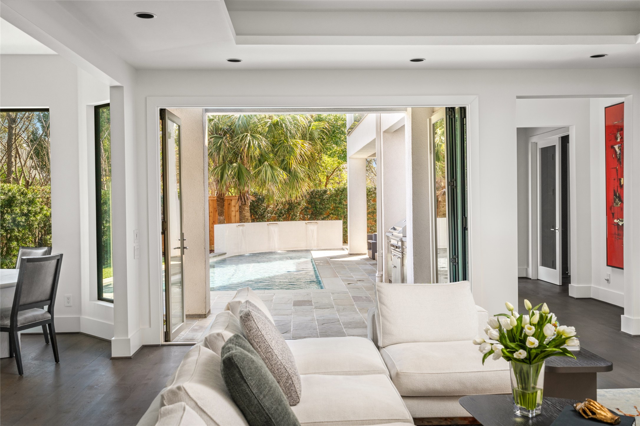 3703 Wroxton Road West University Place, TX 77005 - Photo 16 of 50 The living room doors bi-fold to open fully making the indoors and the outdoors seamless.