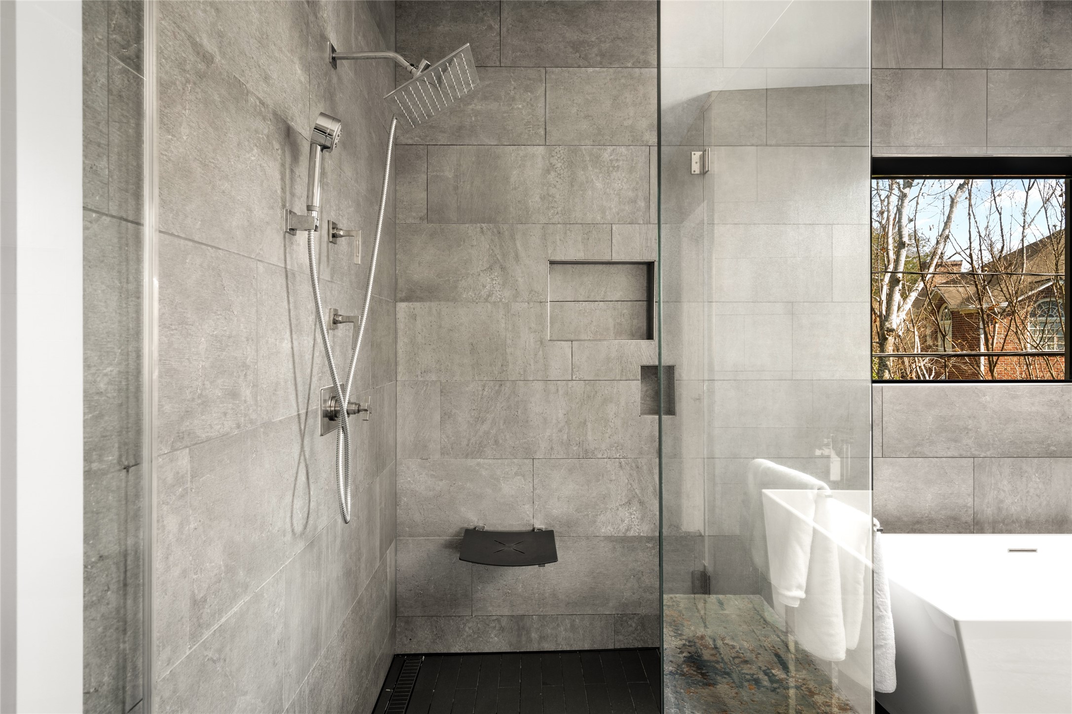 3703 Wroxton Road West University Place, TX 77005 - Photo 31 of 50 A rainfall showerhead, and a built-in bench.