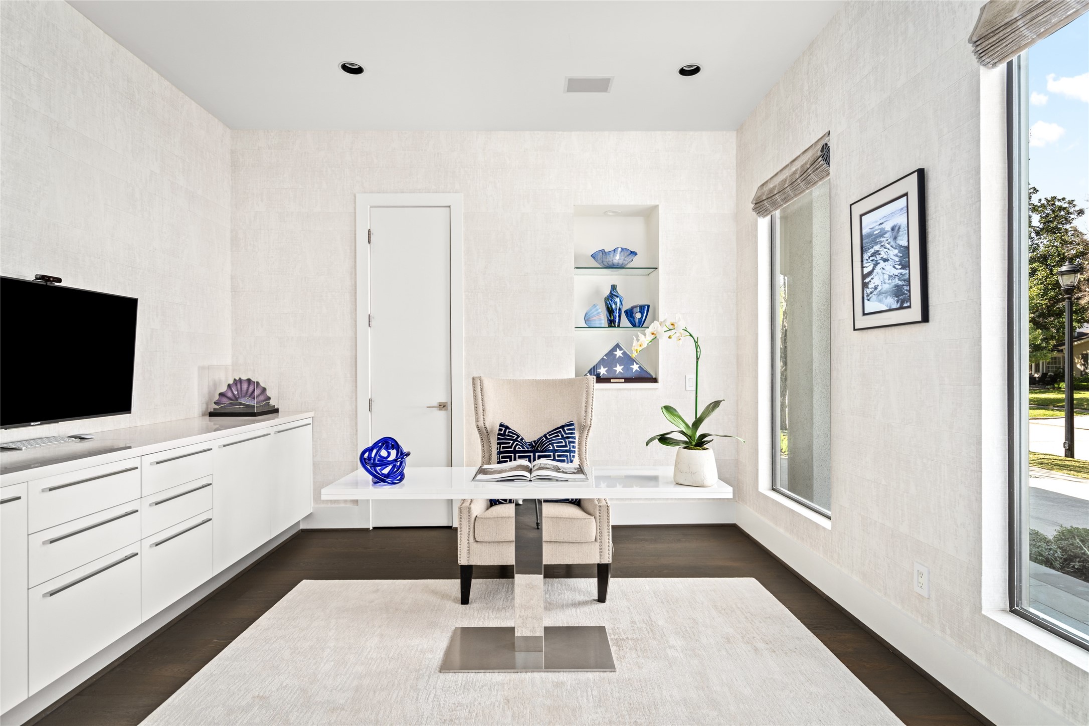 3703 Wroxton Road West University Place, TX 77005 - Photo 4 of 50 Bright, modern office space with large windows, and built-in cabinets.