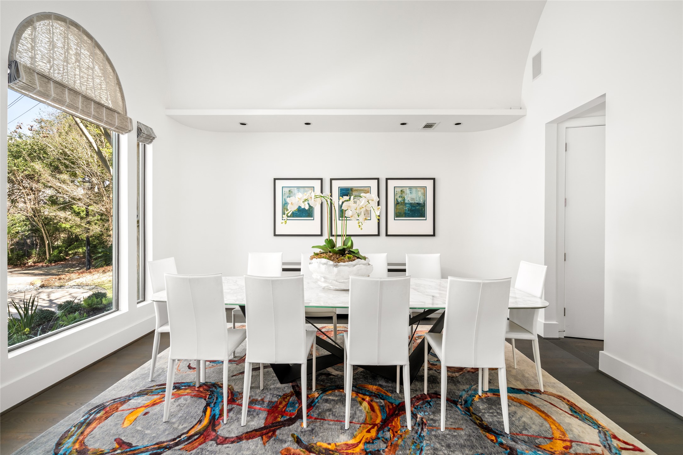 3703 Wroxton Road West University Place, TX 77005 - Photo 7 of 50 Bright and modern dining room with a large window and barrel vaulted ceiling.