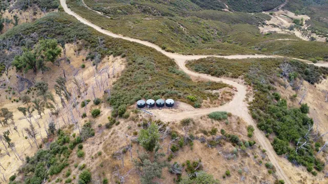 an aerial view of a house with a yard