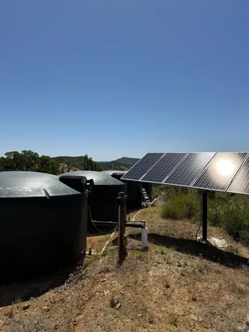a view of a lake with a yard
