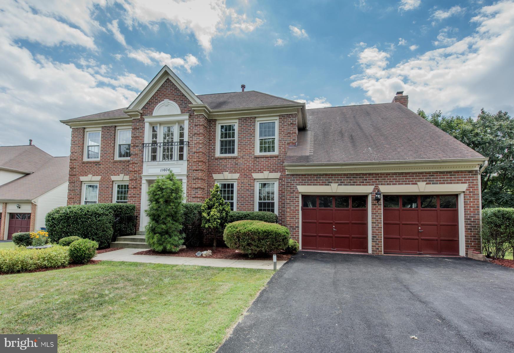 11606 Letterman Way Gaithersburg, MD 20878 - Photo 1 of 30 a front view of a house with a yard and garage