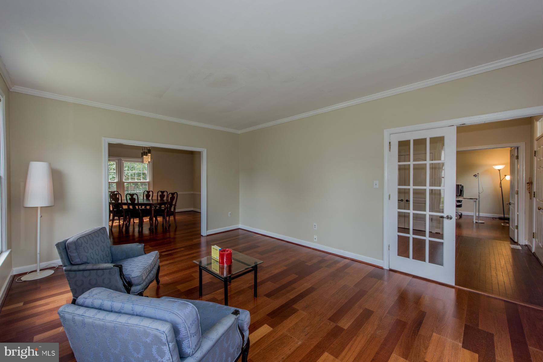 11606 Letterman Way Gaithersburg, MD 20878 - Photo 7 of 30 a living room with furniture and wooden floor