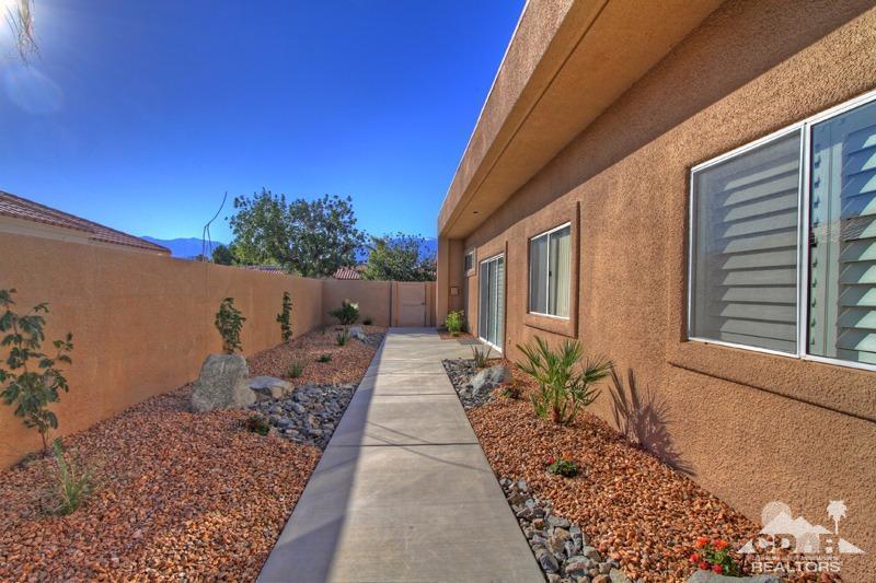 39 Colonial Drive Rancho Mirage, CA 92270 - Photo 12 of 34 a backyard of a house with outdoor seating