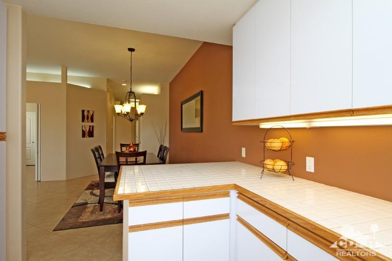 39 Colonial Drive Rancho Mirage, CA 92270 - Photo 13 of 34 a view of a kitchen with a sink and chandelier