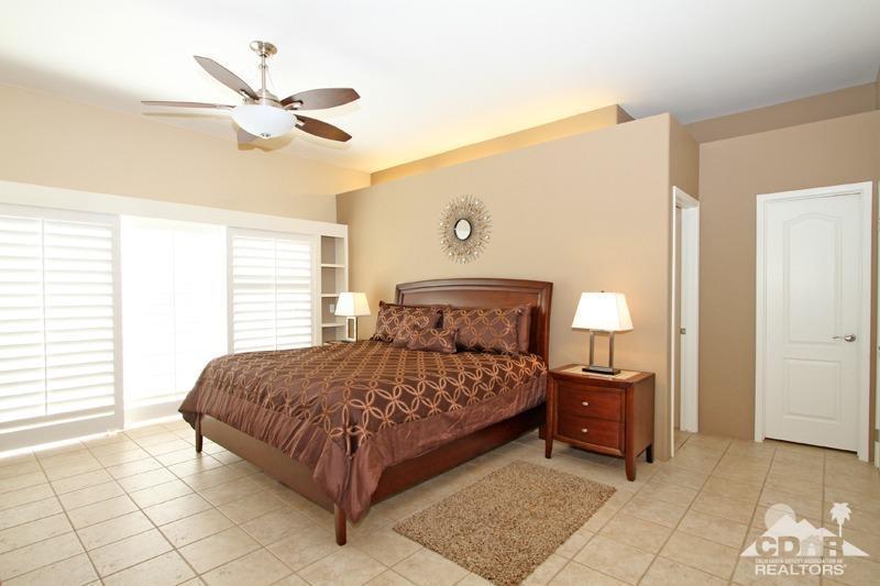 39 Colonial Drive Rancho Mirage, CA 92270 - Photo 17 of 34 a bedroom with a bed and a window