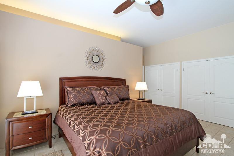 39 Colonial Drive Rancho Mirage, CA 92270 - Photo 18 of 34 a bedroom with a bed and a night stand
