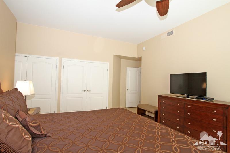 39 Colonial Drive Rancho Mirage, CA 92270 - Photo 19 of 34 a bedroom with a bed and a flat screen tv