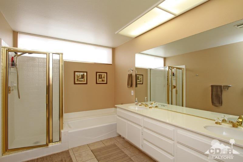 39 Colonial Drive Rancho Mirage, CA 92270 - Photo 20 of 34 a bathroom with a bathtub shower sink and mirror