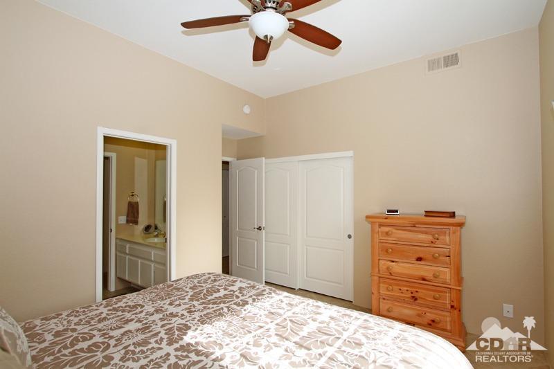 39 Colonial Drive Rancho Mirage, CA 92270 - Photo 23 of 34 a bedroom with a bed and a dresser