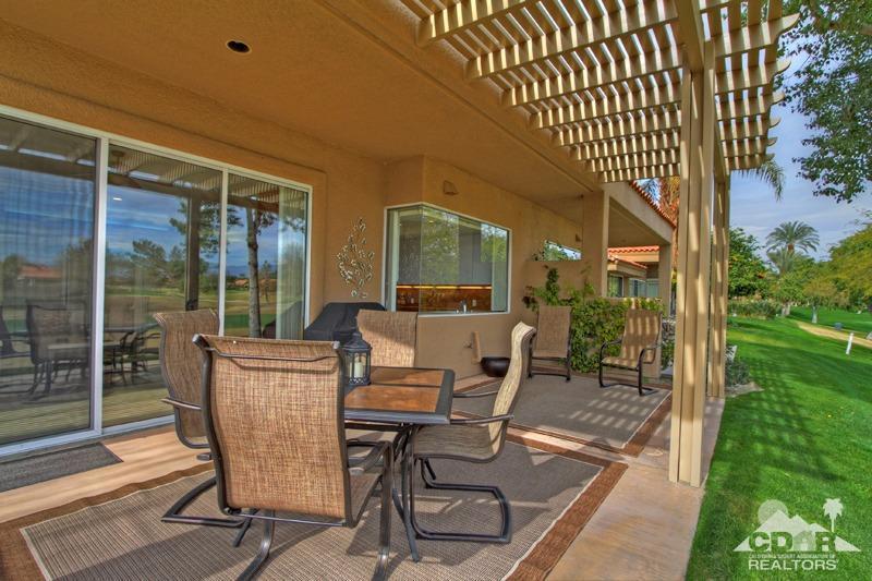 39 Colonial Drive Rancho Mirage, CA 92270 - Photo 25 of 34 a patio with table and chairs and potted plants