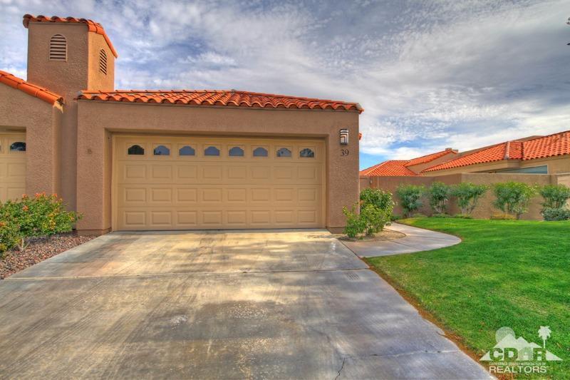 39 Colonial Drive Rancho Mirage, CA 92270 - Photo 26 of 34 a front view of a house with garden