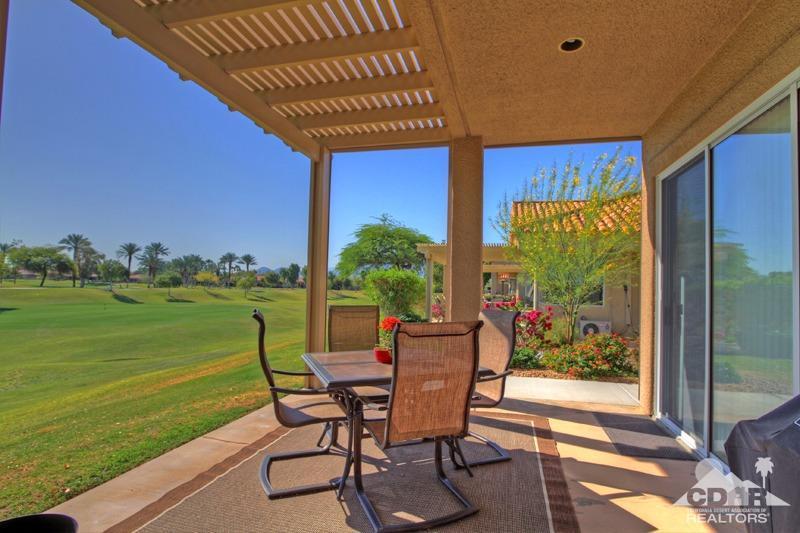 39 Colonial Drive Rancho Mirage, CA 92270 - Photo 30 of 34 a view of a backyard with table and chairs and potted plants