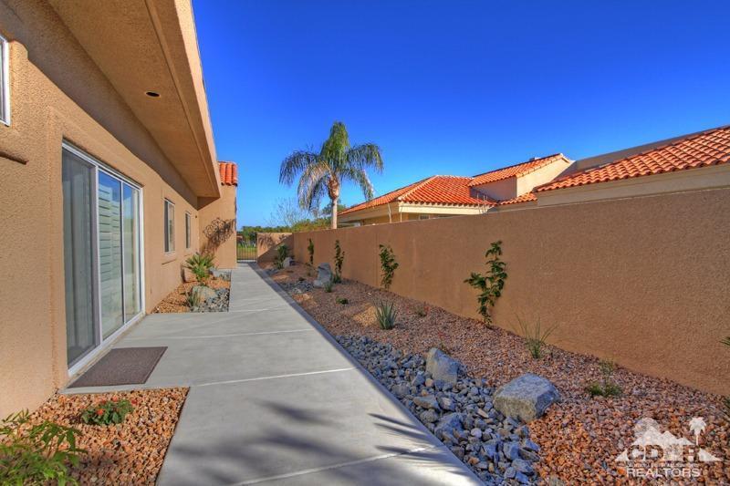 39 Colonial Drive Rancho Mirage, CA 92270 - Photo 32 of 34 a view of a house with a backyard