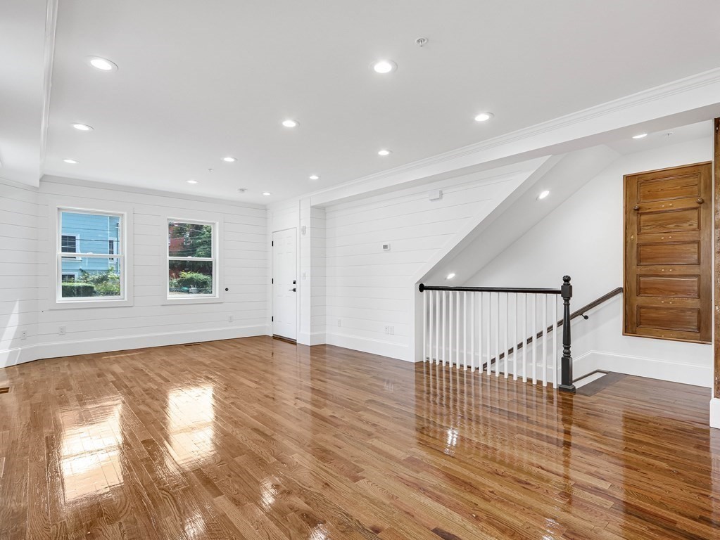 30 Copeland Street, Unit 1 Boston, MA 02119 - Photo 11 of 40 a view of empty room with wooden floor and window
