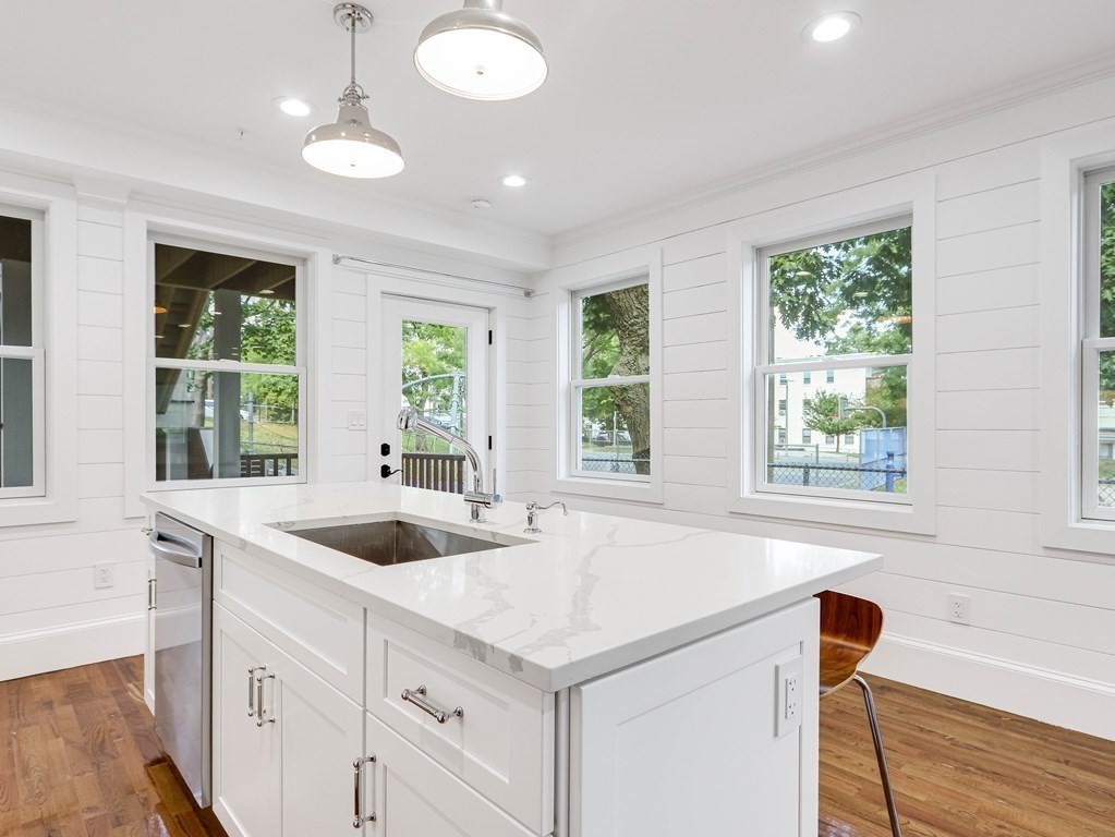 30 Copeland Street, Unit 1 Boston, MA 02119 - Photo 13 of 40 a kitchen with a sink and large window