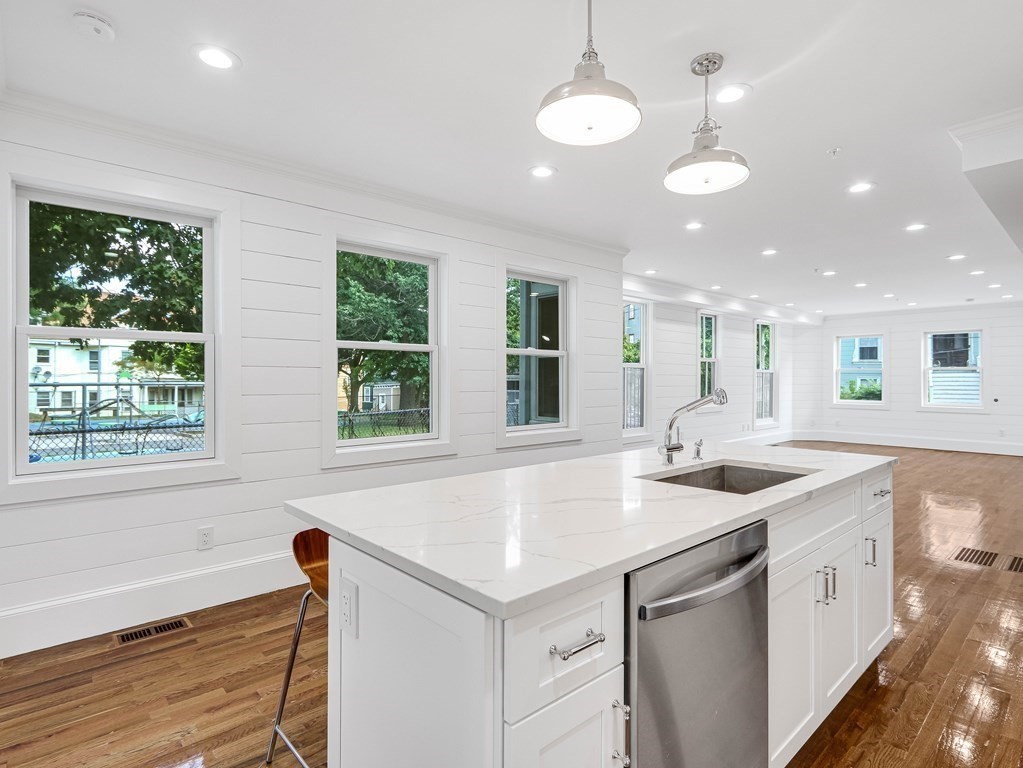 30 Copeland Street, Unit 1 Boston, MA 02119 - Photo 14 of 40 a kitchen that has a sink and a large window