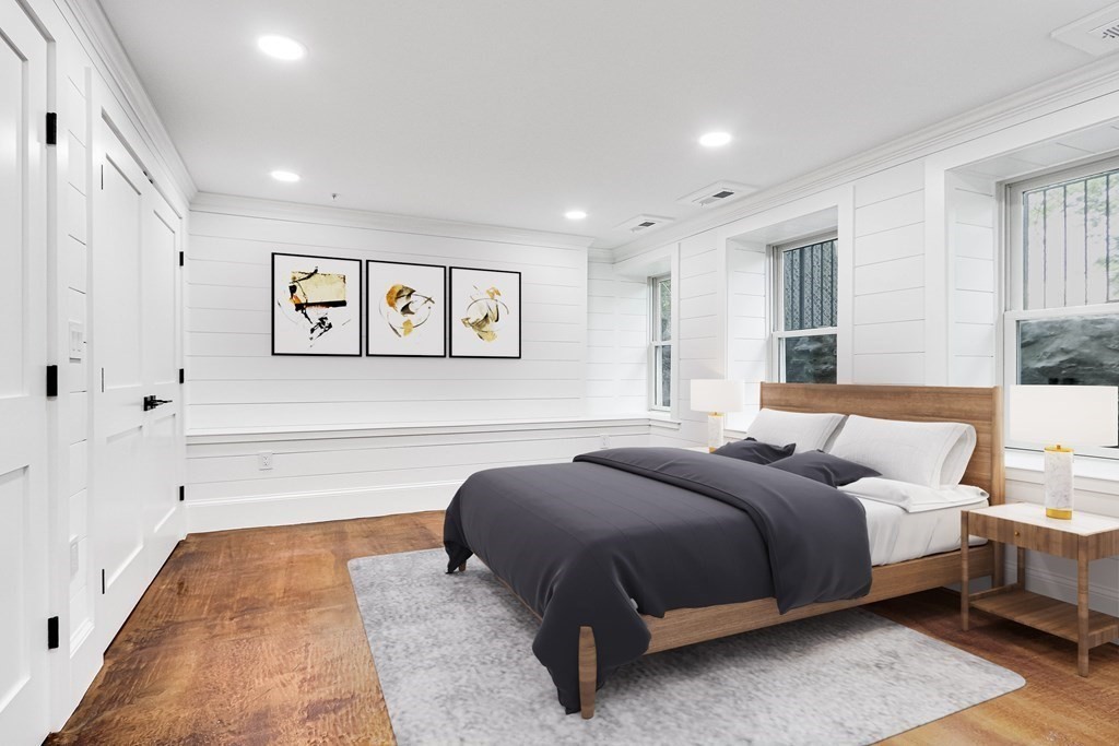 30 Copeland Street, Unit 1 Boston, MA 02119 - Photo 3 of 40 a spacious bedroom with a bed and window