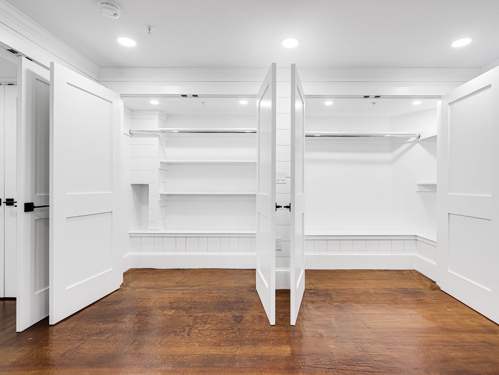 30 Copeland Street, Unit 1 Boston, MA 02119 - Photo 31 of 40 a view of an empty room with a window and wooden floor