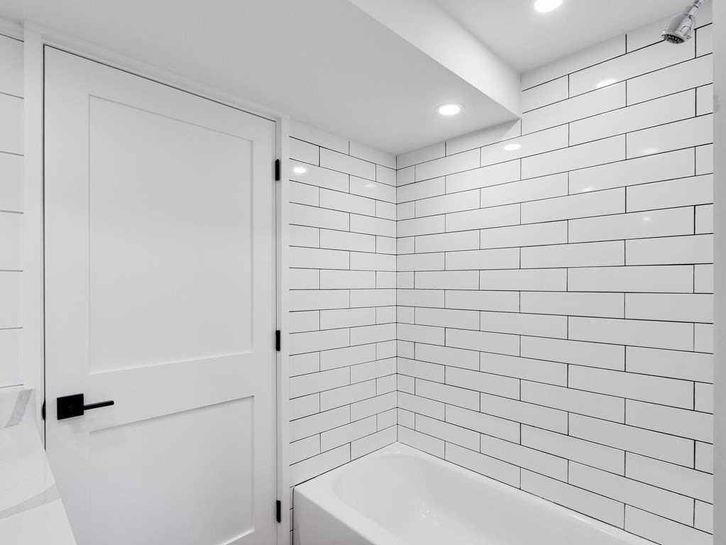 30 Copeland Street, Unit 1 Boston, MA 02119 - Photo 34 of 40 a bathroom with a shower and a bathtub