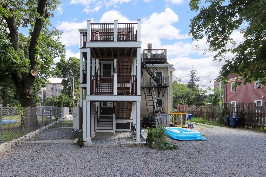 30 Copeland Street, Unit 1 Boston, MA 02119 - Photo 40 of 40 a view of multiple house with a yard and large tree