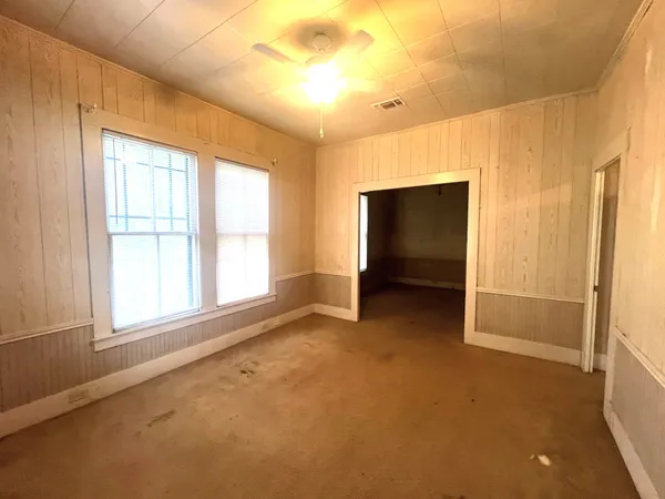 a view of an empty room with a window