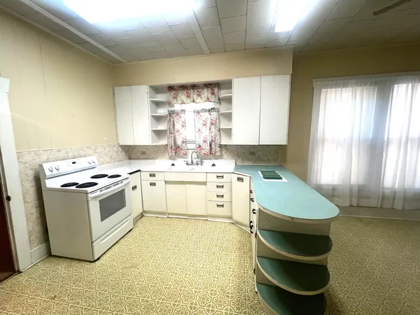 a view of a storage & utility room with a window