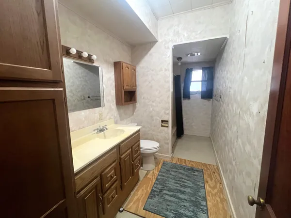 a view of room with window and hardwood floor