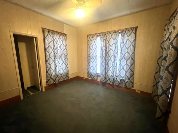 an empty room with windows